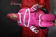 Watching sexy Pia being tied and gagged with ropes and a clothgag on a hairdressers chair wearing a very sexy pink rainwear combination with hood (Pics)