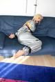 Blond-haired maid tied and gagged with tape wearing a shiny silver PVC sauna suit (Pics)