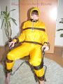 Jill tied, gagged and hooded with a tension belt on a chair wearing a supersexy yellow shiny nylon rainpants and rain jacket (Pics)