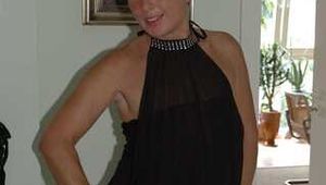 Blonde mature Claudia stipping out of a black dress