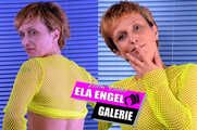 Ela Engel in the studio with yellow fishnet shirt