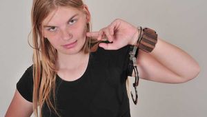 Lisa wearing a huge OOZOO cuff watch and handcuffs! 