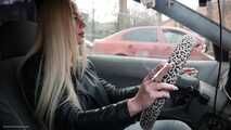 Ekaterina is smoking while driving her car