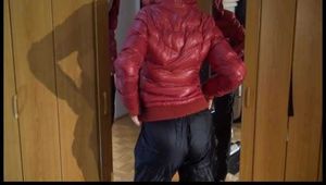 Lucy wearing a sexy very thin adidas rain pants and a red shiny down jacket posing infront of the mirror (Video)