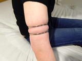 Tight closed metal rings for Leas beautiful white upper arms