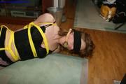 Lucy hogtied with thin yellow rope
