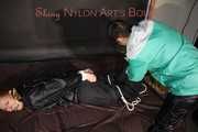 SEXY RONJA being overhelmed, tied and gagged from Stella with ropes and a ballgag on a sofa both wearing shiny nylon rainwear (Pics) Part 2