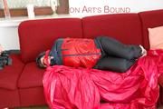 Jill tied, gagged and hooded by Sophie wearing a sexy red/blue rainwear combination (Video)