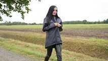 Miss Amira in blue Hunter rain jacket and patent leggings