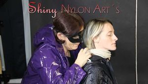 Watching sexy Sonja being tied and gagged from another woman both wearing shiny nylon rainwear (Pics)