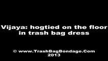 [From archive] Vijaya - captured and hogtaped in her trash bag dress (video)