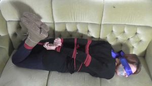 Vanessa hogtie on couch 2/2