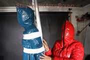 SEXY RONJA wearing shiny nylon downwear being tied and hooded with tapes from Stella on a rack (Pics)