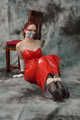 Bound in red PVC dress