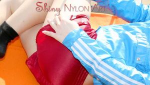 SEXY MONE wearing a hot red shiny nylon shorts and a lightblue shiny nylon rain jacket lolling on the floor of her balcony (Pics)