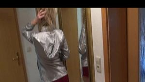 Pia wearing a supersexy red shiny nylon shorts and a silver rain jacket posing infront of the mirror (Video)