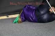 Watching Sandra wearing a sexy shiny nylon rain pants and a rain jacket ties and gagges herself with a bar and a cloth gag on the floor (Pics)