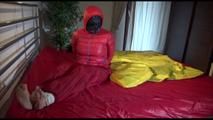 Jill tied, gagged and double-hooded on a bed wearing sexy shiny nylon rain pants and a down jacket (Video)