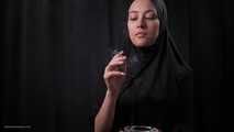 Ksenia is smoking two cigs wearing hijab