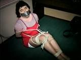25 Yr OLD 2nd GRADE SCHOOL TEACHER GETS MOUTH STUFFED, TAPE GAGGED, BALL-TIED, HOG-TIED, WEARING A GIRDLE, TOE-TIED AND BLINDFOLDED ON THE FLOOR  (D65-12)