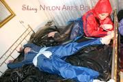 Beautiful archive girl tied, gagged and hooded on a golden bed by Jill both wearing sexy shiny rainwear outfits (Pics)