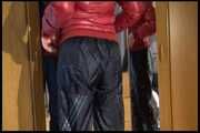 Lucy wearing a sexy very thin adidas rain pants and a red shiny down jacket posing infront of the mirror (Video)