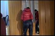 Lucy wearing a sexy very thin adidas rain pants and a red shiny down jacket posing infront of the mirror (Video)