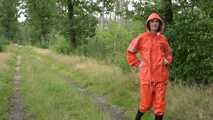 Miss Petra takes a walk in a orange AGU rain suit and rubber boots