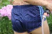 Watching Aiyana wearing only a sexy blue shiny nylon shorts watering the garden (Pics)