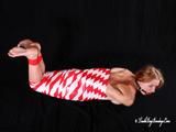 [From archive] Gatiita is mummified topless in red and white tape and hog taped