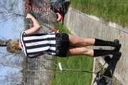 Watching Pia sweeping the terrace wearing a sexy black shiny nylon shorts, a striped top and black rubber boots (Pics)