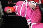 Watching sexy Pia being tied and gagged with ropes and a clothgag on a hairdressers chair wearing a very sexy pink rainwear combination with hood (Pics)