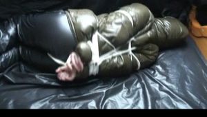 A video with Jill tied and gagged in a shiny nylon downjacket