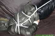 Watch Pia enjoying Bondage in her shiny nylon Downwear