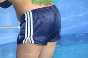 Watch Sandra cleaning the pool wearing a shiny nylon Shorts