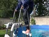 Watch Chloe cleaning the Pool in her shiny nylon Rainwear