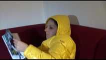 Watching sexy Lucy wearing a orange/yellow shiny nylon downwear combination reaing a magazine and lolling on the sofa (Video)