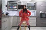 Miss Amira in red nylon rain gear and tranparent rain suit get´s bouind and gagged