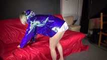 Sexy Sonja preparing her bed wearing sexy shiny nylon shorts and a long rain jacket (Video)