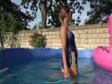 Get a new video with Sandra enjoying the Summer in the Garden with Table-Tennis and a Pool in her shiny nylon Shorts