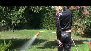 Pia wearing a sexy black/pink adidas sweat suit while watering the flowers in the garden (Video)