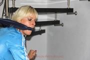 Pia tied and gagged in shiny nylon clothes