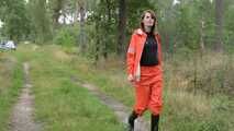 Miss Petra takes a walk in a orange AGU rain suit and rubber boots