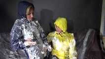 Watching sexy Stella and Sandra having fun with shaving cream and eachother both wearing shiny nylon rainwear (Video)