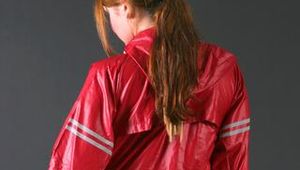 Anastasia posing in a foto studio wearing supersexy rainwear (Pics)