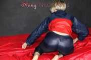 Watching Sonja wearing a black shiny nylon rain pants and a shiny nylon rain jacket preparing bed (Pics)