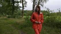 Miss Petra takes a walk in a orange AGU rain suit and rubber boots