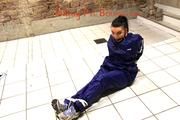 Jill tied and gagged in an old cellar on the floor wearing a shiny blue PVC sauna suit (Pics)