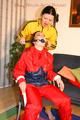 Jill tied, gagged and double hooded on a chair by an archive girl both wearing shiny rainwear (Pics)