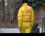Jill wearing a yellow rain pants down jacket combination and rubber boots at home and outdoor (Video)